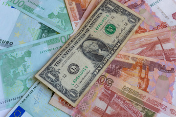 Fototapeta na wymiar one dollar, euro and rubles