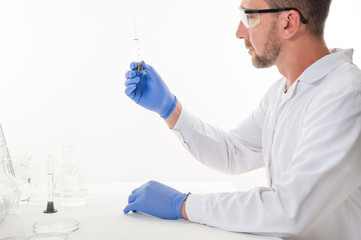 man in the laboratory / view of a man in the laboratory while performing experiments
