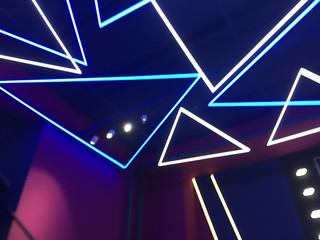 Blue white purple neon lights on ceiling and wall