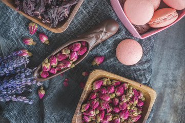 Dry rose buds for tea and dried and dried in hibiscus sugar. Chinese tea from Yunnan. Bi Lo Chun. Copy space. The view from the top. Selective focus