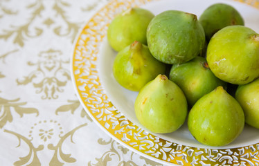 green figs on a plate detail