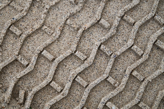 Tire tracks in the sand during construction