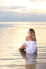 Fototapeta na wymiar portrait of a romantic girl on a sunset background