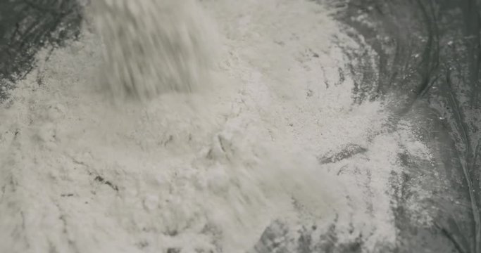 Slow motion adding hardener to micro concrete plaster