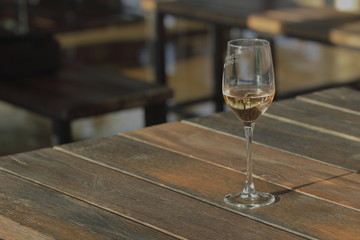 wine glass with wine on a wooden table