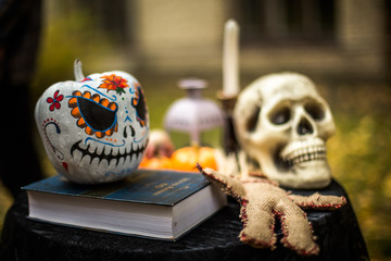 Scary human skull, Voodoo doll and pumpkin Halloween.