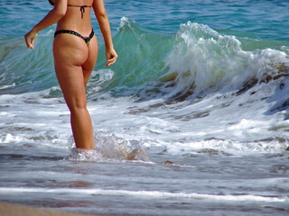 Fototapeta premium young Sexy woman in bikini on background blue sea
