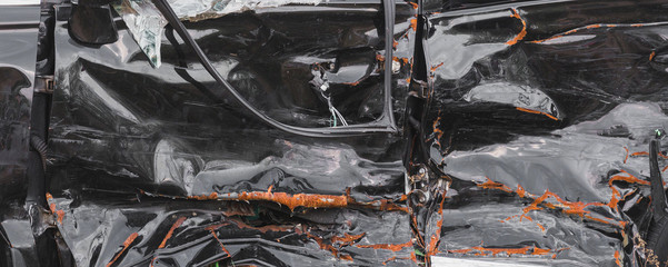 crashed doors of off-road car after the accident are on the sidelines