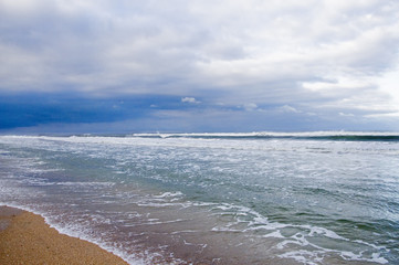 Ocean and Sky at Florida beach with storm clouds on horizon.