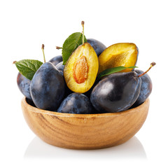 Cup full of ripe prunes. Fruits isolated on white background