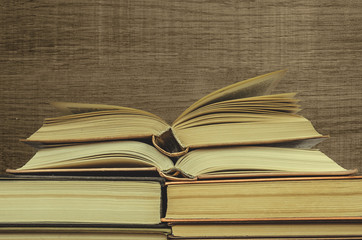 Stack of books on wooden background