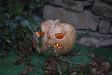 jack-o-lantern on the ground outdoors. Halloween the night