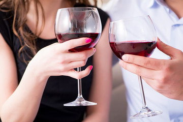 Young pair drinking wine in romantic concept