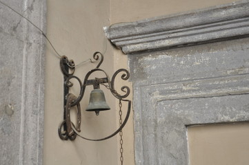 Bell on wall, Italy