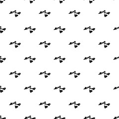 Seamless pattern with hand drawn curling irons for eyelashes,