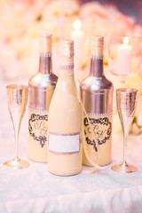 Wedding decor with wedding glasses , bottles. Decoration of a wedding photoshoot. Details of a wedding decor.
