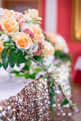 flower arrangement, crystal, glass candles decorate banquet hall