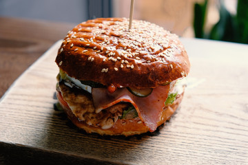 delicious craft burger on the wooden table.