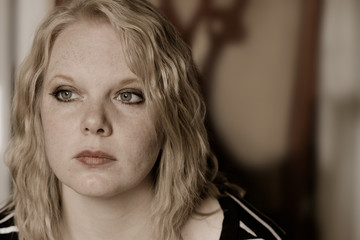 Young Blonde Woman In Deep Thought