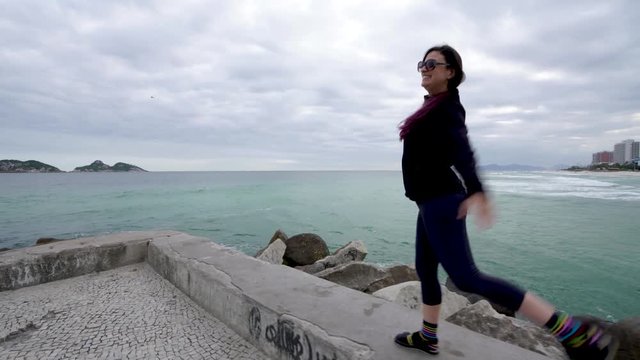 Brazilian young Woman sea shore health fitness activity beach Rio de janeiro, Brazil