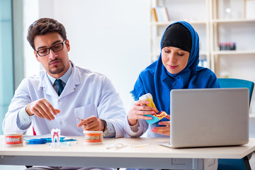 Dentist doctor and assistant working on new tooth implant
