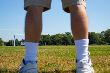 man standing in a soccer field