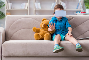 Young little boy with VR virtual reality glasses