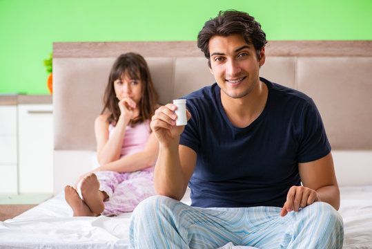 Man using pills for woman satisfaction  