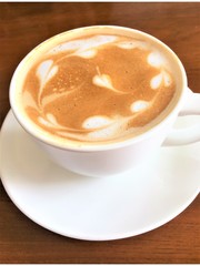 Cappuccino  Hot coffee in a white cup on table
