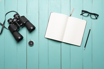 binoculars on green wooden floor