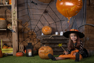 girl in a halloween witch costume