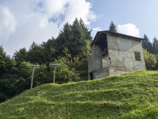 Fototapeta premium Valcanale, Bergamo, Italy. Abandoned ski resort in 1998. Lift and old buildings