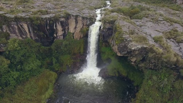 Aerial Of A Waterfall In The Rio Pita Valley Near Cotopaxi Volcano, Ecuador.  Running Off A Cliff Comprised Of An Old Andesitic Lava Flow.