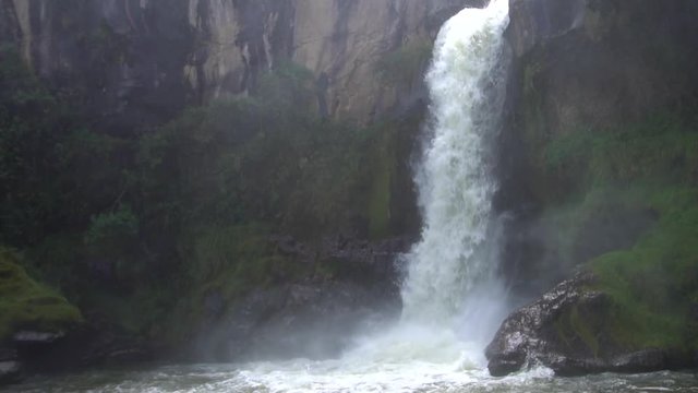 Slow motion shot of a waterfall in the Rio Pita Valley near Cotopaxi Volcano, Ecuador