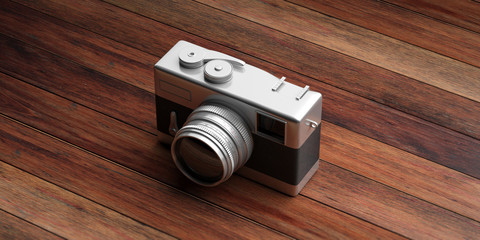 Retro camera, isolated on wooden background, 3d illustration.