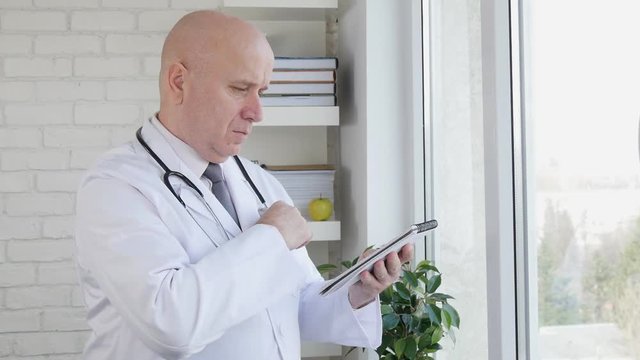 Slow Motion with Doctor Interior Hospital Taking Notes Using a Pen and Agenda 