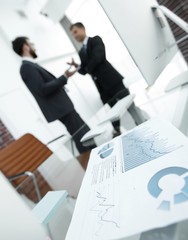 financial graph on the desktop in the office