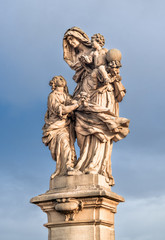 The sculpture "Saint Anna with Child" on the Charles Bridge in Prague, Czech Republic