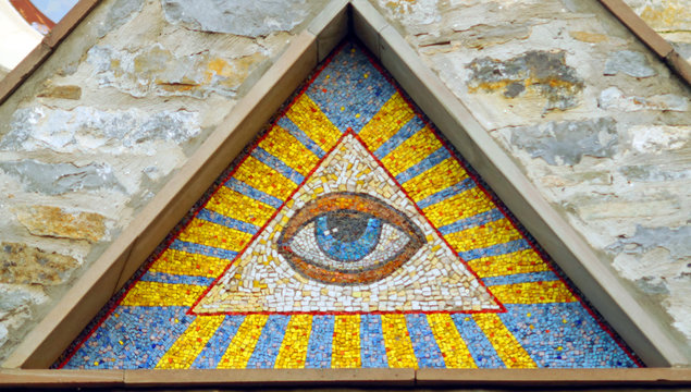 All-seeing eye of God - a mosaic of wall background medieval church