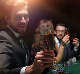 poker player with a glass of wine