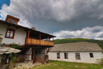 Old houses in the historical cultural reserve village of Dolen, Bulgaria. Dolen is famous with its 350 old houses – an example of 19th century Rhodopean architecture.