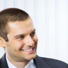 Fototapeta premium Happy smiling young businessman