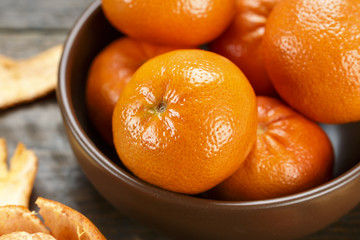 tangerines in a peel in a plate