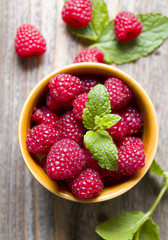 Delicious fresh raspberries on wood