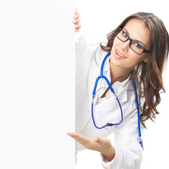 Doctor showing blank signboard, isolated