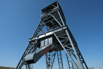 Oil drilling rig on blue sky