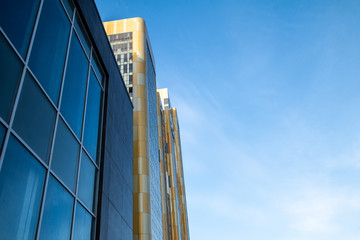 yellow and blue skyscrapper facade background