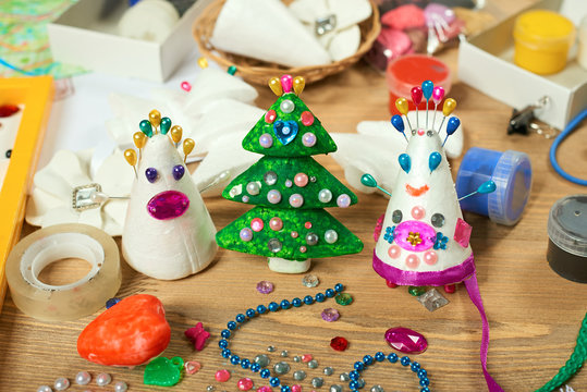 Handmade decorations for new year and other holidays. Artwork workplace with creative accessories.