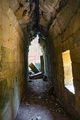 Inside ta prohm temple with broken path
