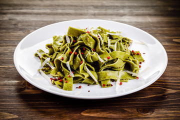 Pasta with cheese on wooden table